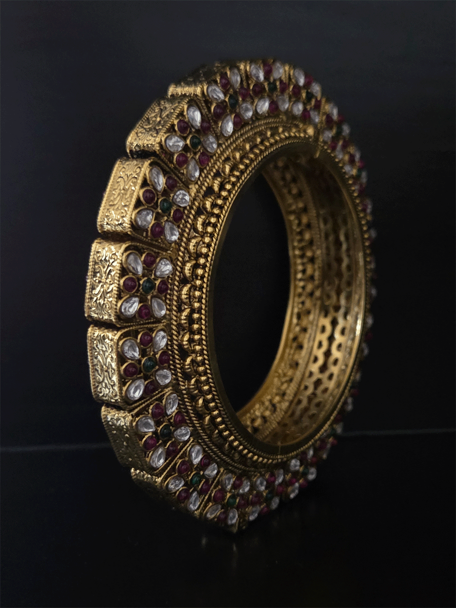Set of two openable pacheli jadau gold top design kada's with ruby, green stones and kundan studded on sides