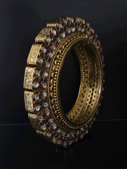 Set of two openable pacheli jadau gold top design kada's with ruby, green stones and kundan studded on sides