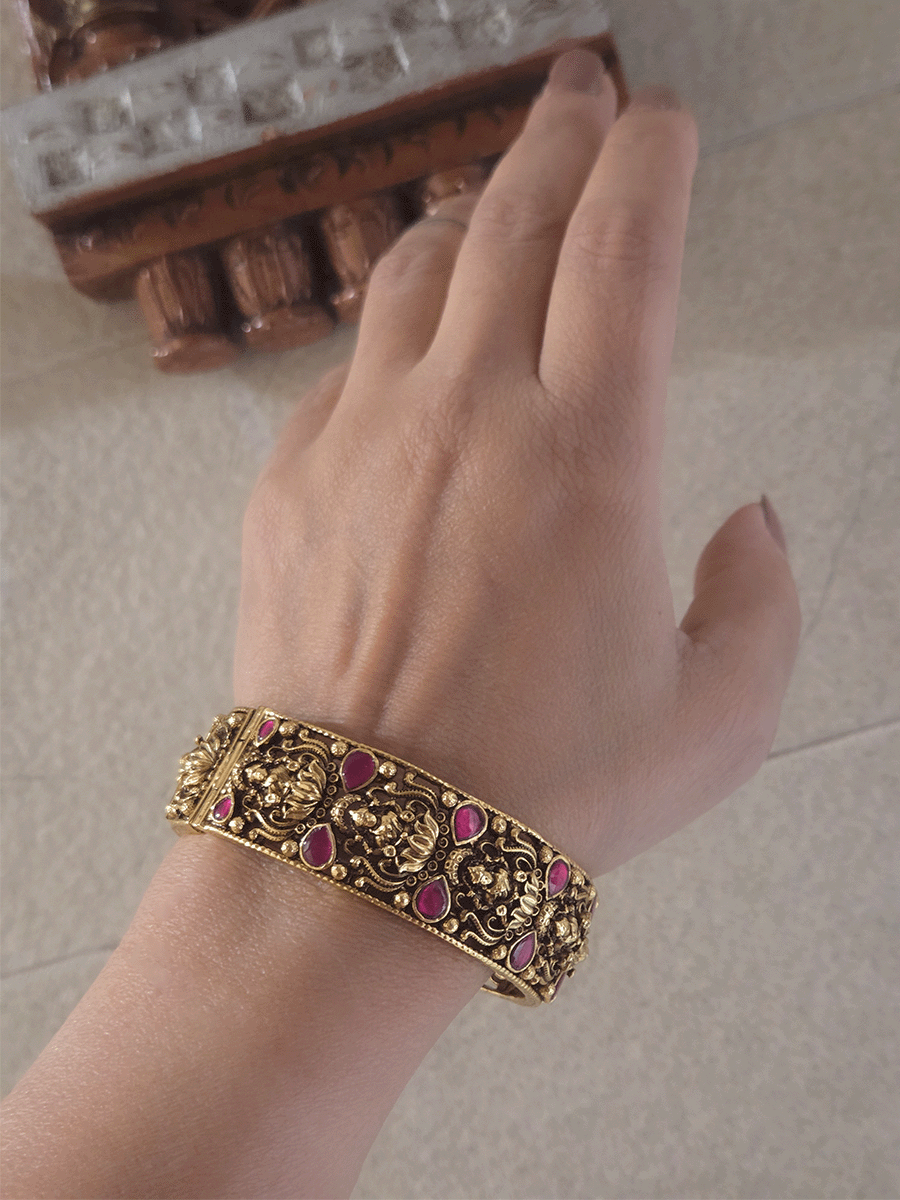 Set of two openable antique gold finish laxmiji kada's with ruby stones