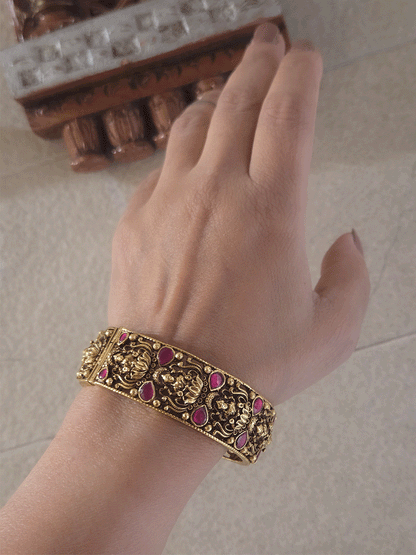 Set of two openable antique gold finish laxmiji kada's with ruby stones