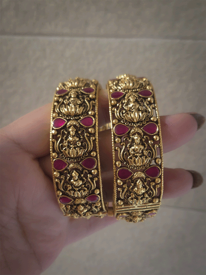 Set of two openable antique gold finish laxmiji kada's with ruby stones