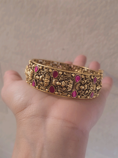 Set of two openable antique gold finish laxmiji kada's with ruby stones
