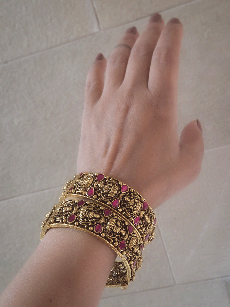 Set of two openable antique gold finish laxmiji kada's with ruby stones