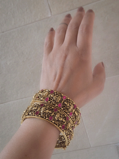 Set of two openable antique gold finish laxmiji kada's with ruby stones