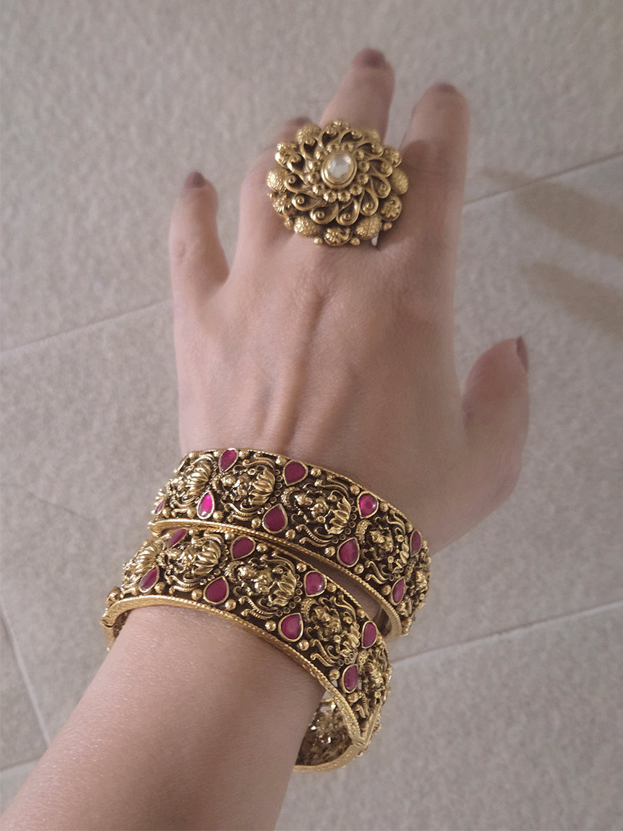 Set of two openable antique gold finish laxmiji kada's with ruby stones