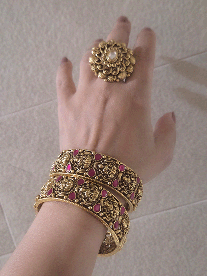 Set of two openable antique gold finish laxmiji kada's with ruby stones