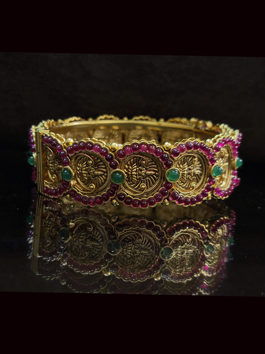 Set of two ruby and green stones studded laxmiji coin design openable kadas