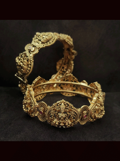 Set of two openable laxmiji motif kada's with ruby stones in between