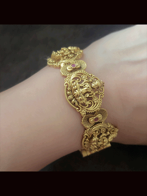 Set of two openable laxmiji motif kada's with ruby stones in between