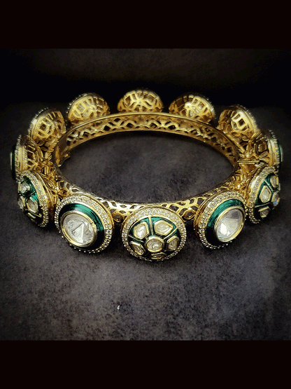 Set of two openable green enamel uncut polki with zircon detailing pacheli's