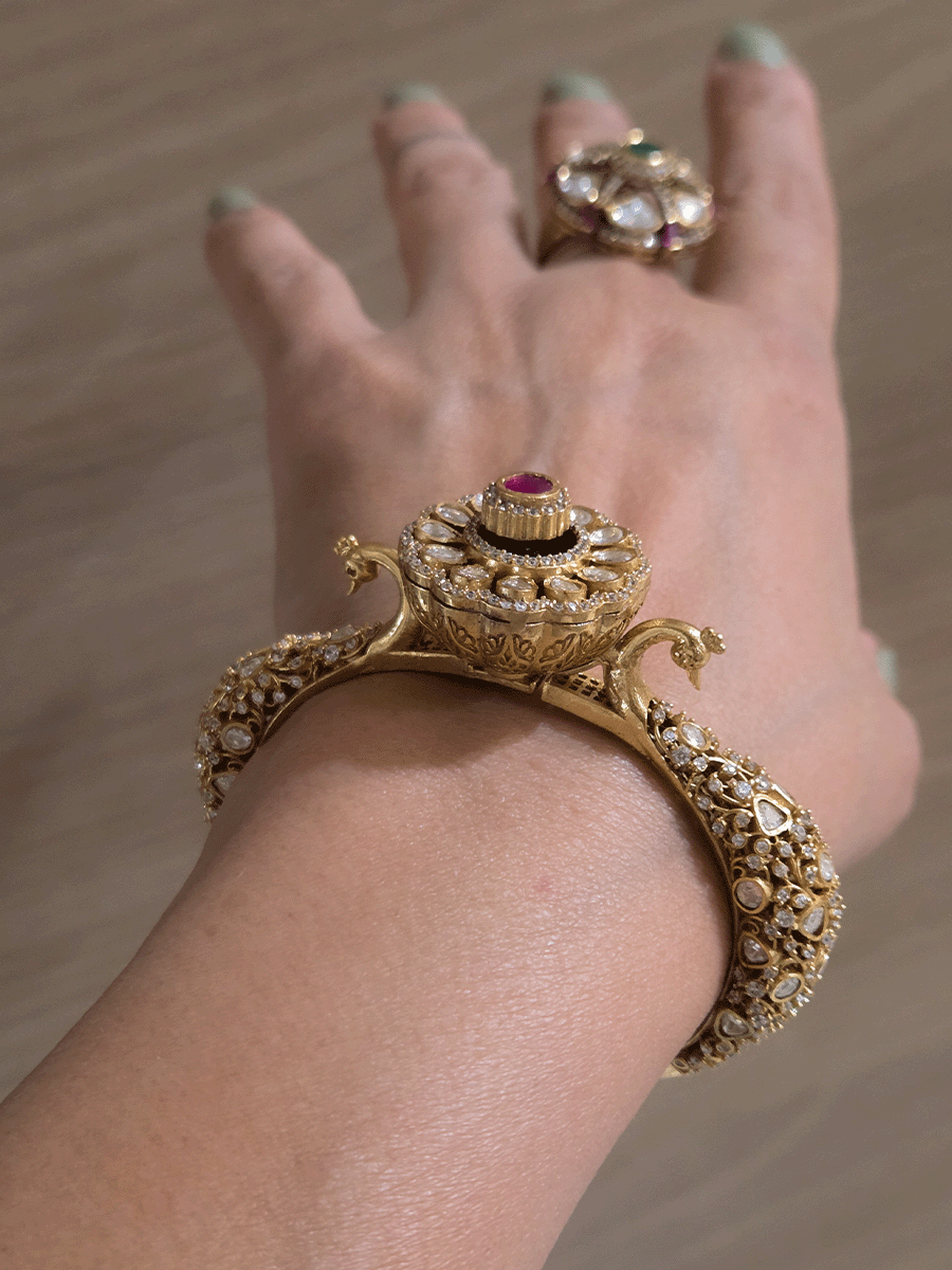Single openable intricate carving with peacocks on sides moissanite kada with flower design in center
