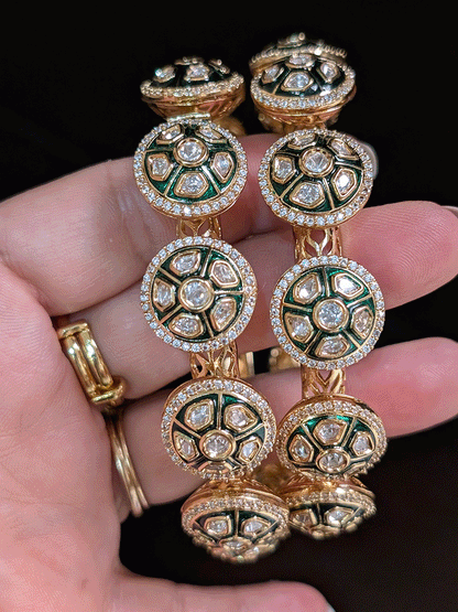 Set of two green enamel uncut polki round openable pacheli's