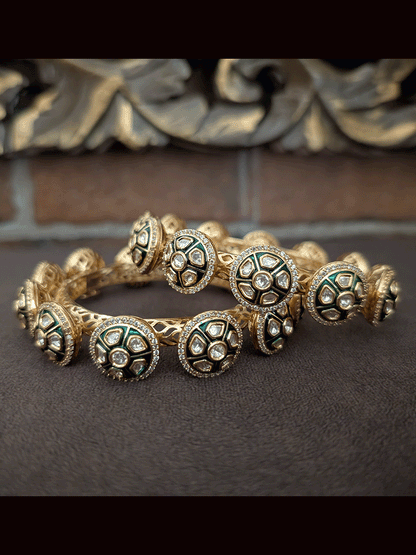 Set of two green enamel uncut polki round openable pacheli's