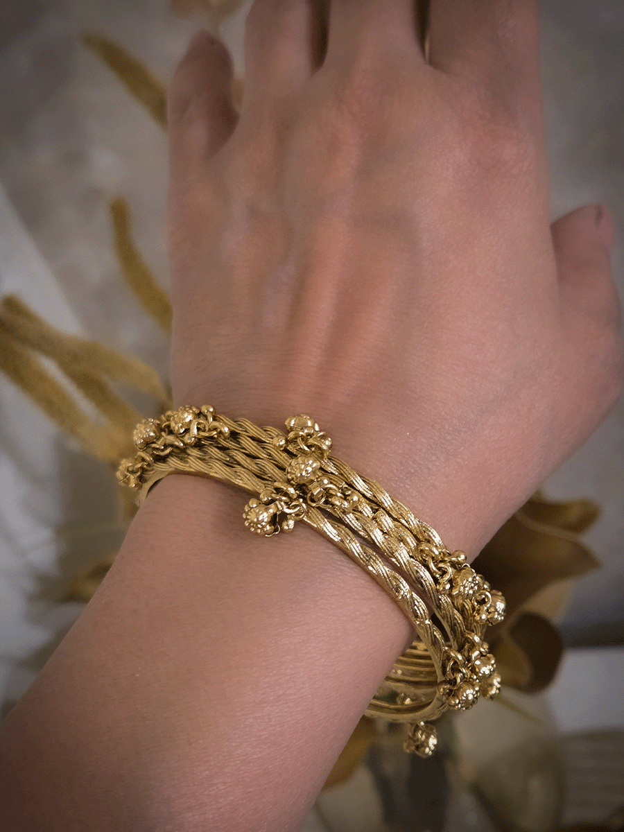 Set of four rope design bangles with ghunghru hangings
