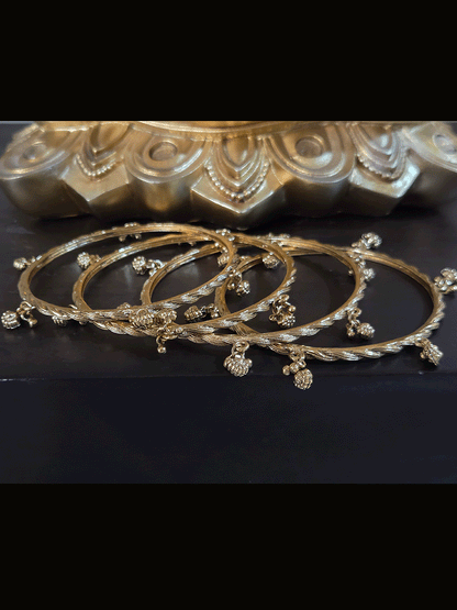 Set of four rope design bangles with ghunghru hangings