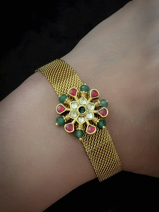Paachi kundan flower with ruby and green bead detailing adjustable bracelet