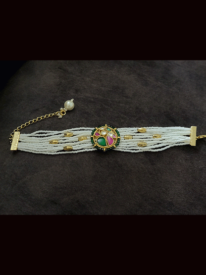 Circular pacchi kundan tukdi with peacock design cheed string bracelet