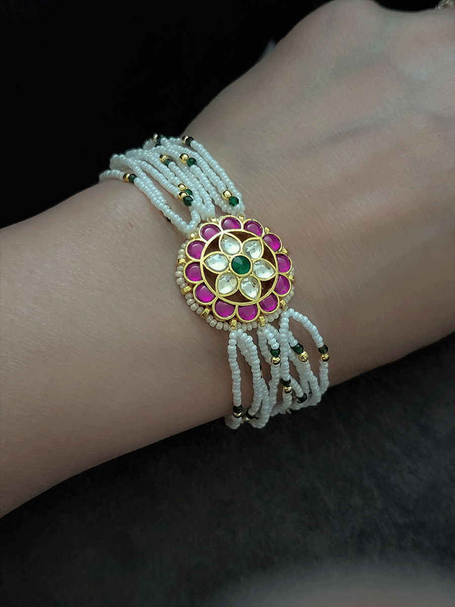 Flower design paachi kundan ruby, green and white cheed string bracelet