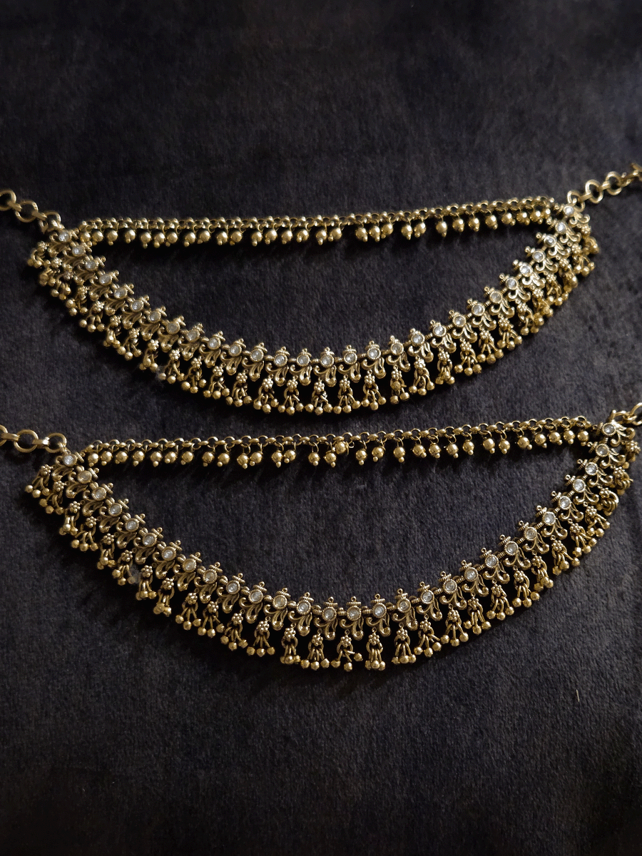 Double layer kundan studded with intricate leaf and flower design ear chains