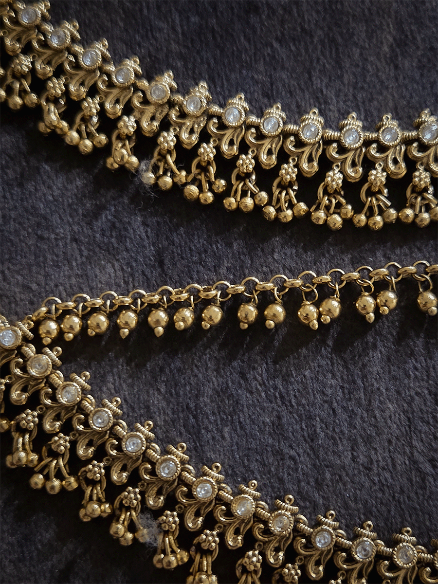 Double layer kundan studded with intricate leaf and flower design ear chains