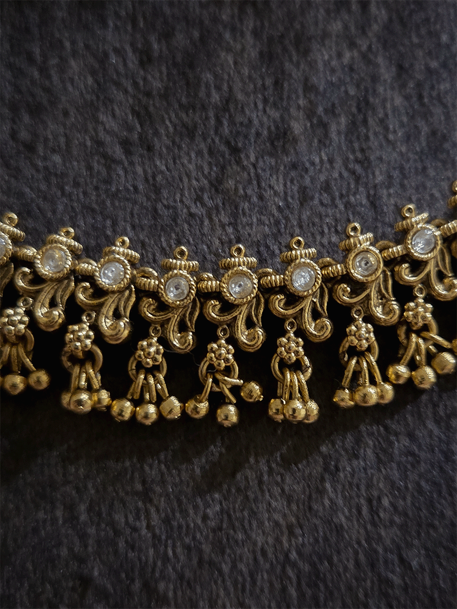 Double layer kundan studded with intricate leaf and flower design ear chains