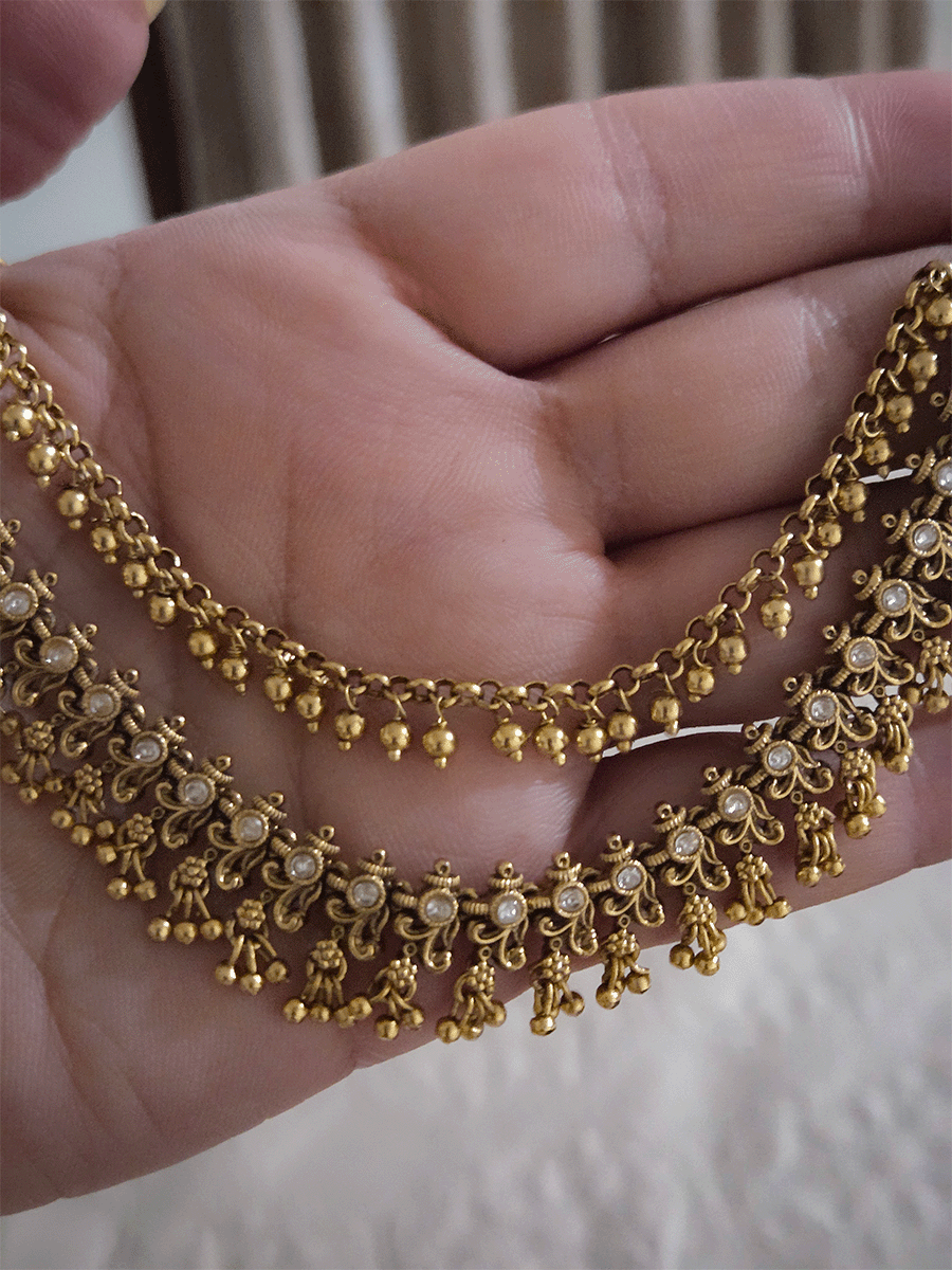 Double layer kundan studded with intricate leaf and flower design ear chains