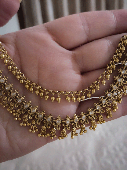 Double layer kundan studded with intricate leaf and flower design ear chains