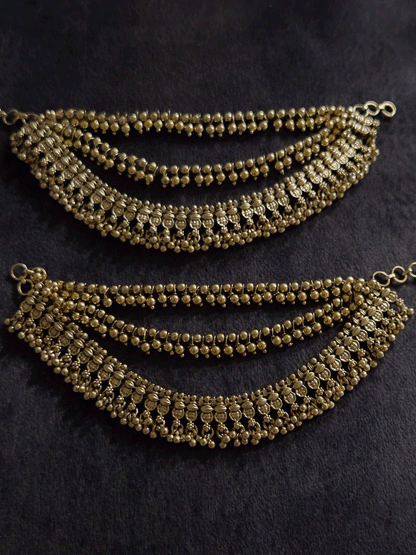 Three layers with bead hangings and circular self design ear chains