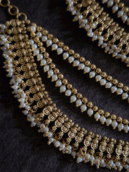 Three layers with bead hangings and circular self design ear chains