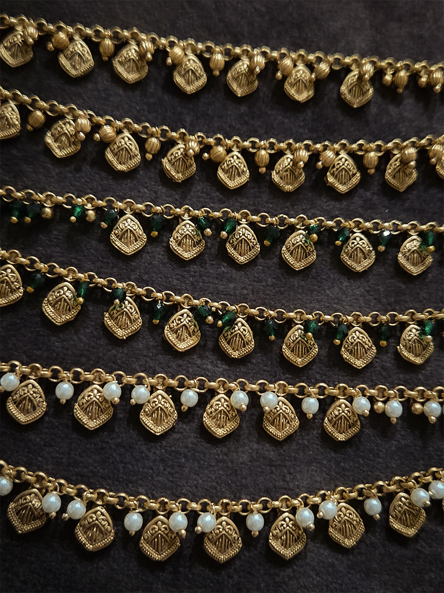 Two layer traditional self design tukdies with pearl hangings ear chains