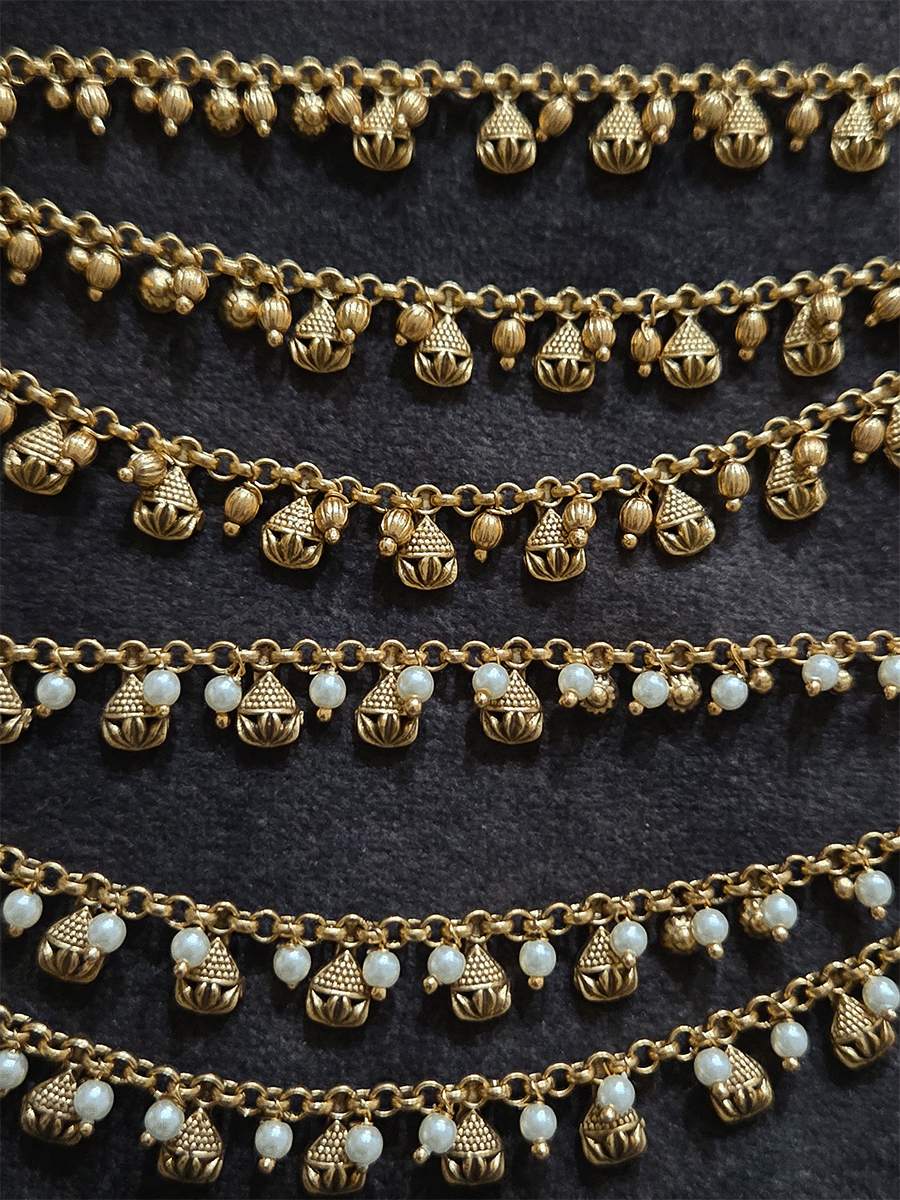 Dotted and leaf design in golden tukdies three layer ear chains