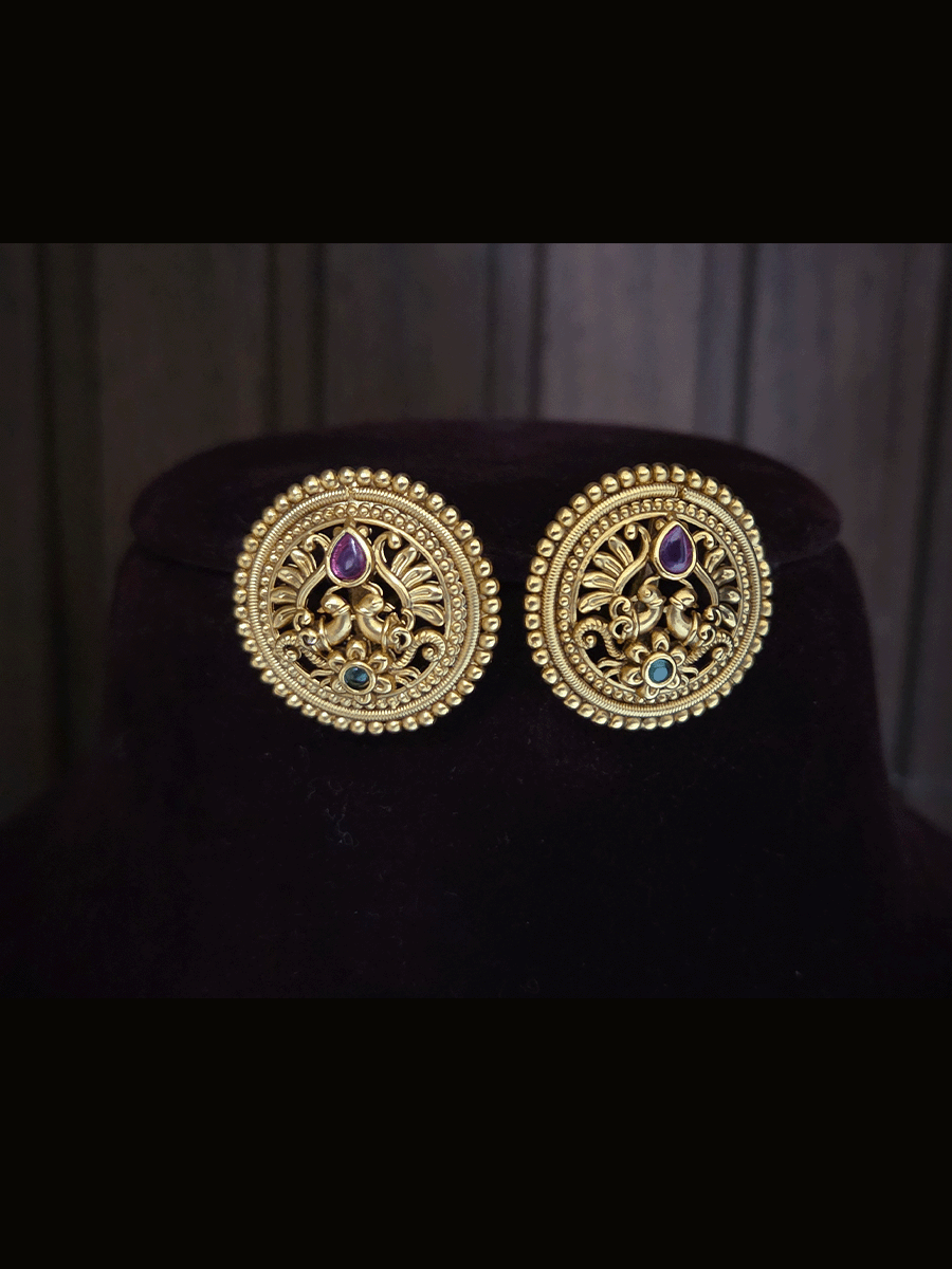 Circular flower with green stone at bottom of peacock design studs with tear shaped ruby stone
