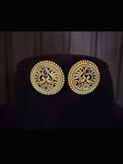 Circular flower with green stone at bottom of peacock design studs with tear shaped ruby stone