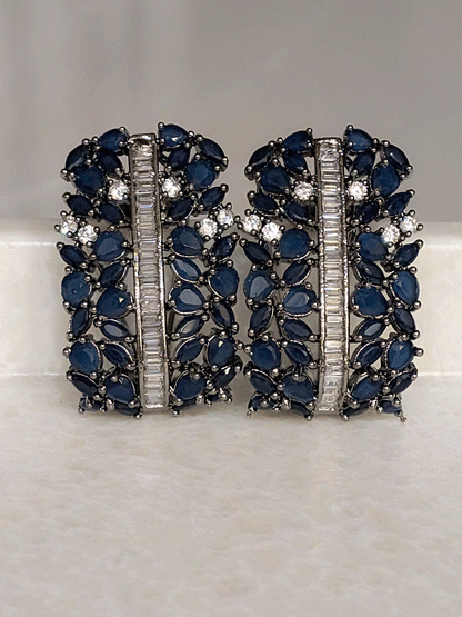 Pear shaped coloured stones and AD studded black finish earrings