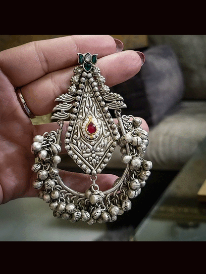 9cm long german silver kite shaped self design center with ghunghru hangings at the bottom(weight 38gm single earring)