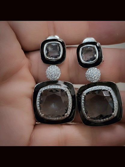Silver finish black enamel square stone earrings with zircon studded center peice