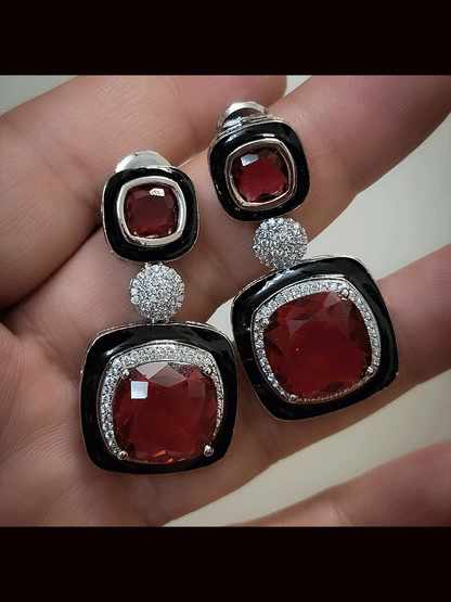 Silver finish black enamel square stone earrings with zircon studded center peice