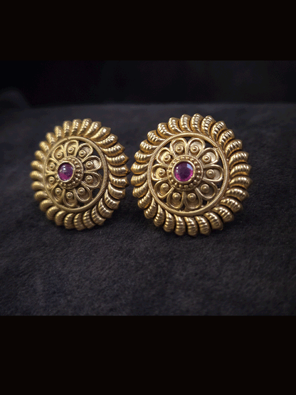 Round ruby stone flower center 3cm broad studs with leaf design on circumference