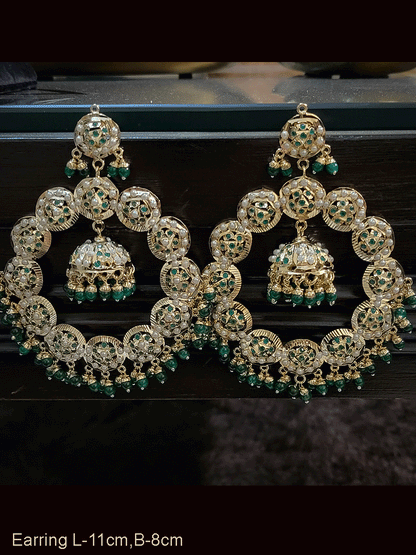 Bold 11cm long jadau chandbali earrings with jhoomki hanging in the center
