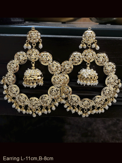 Bold 11cm long jadau chandbali earrings with jhoomki hanging in the center