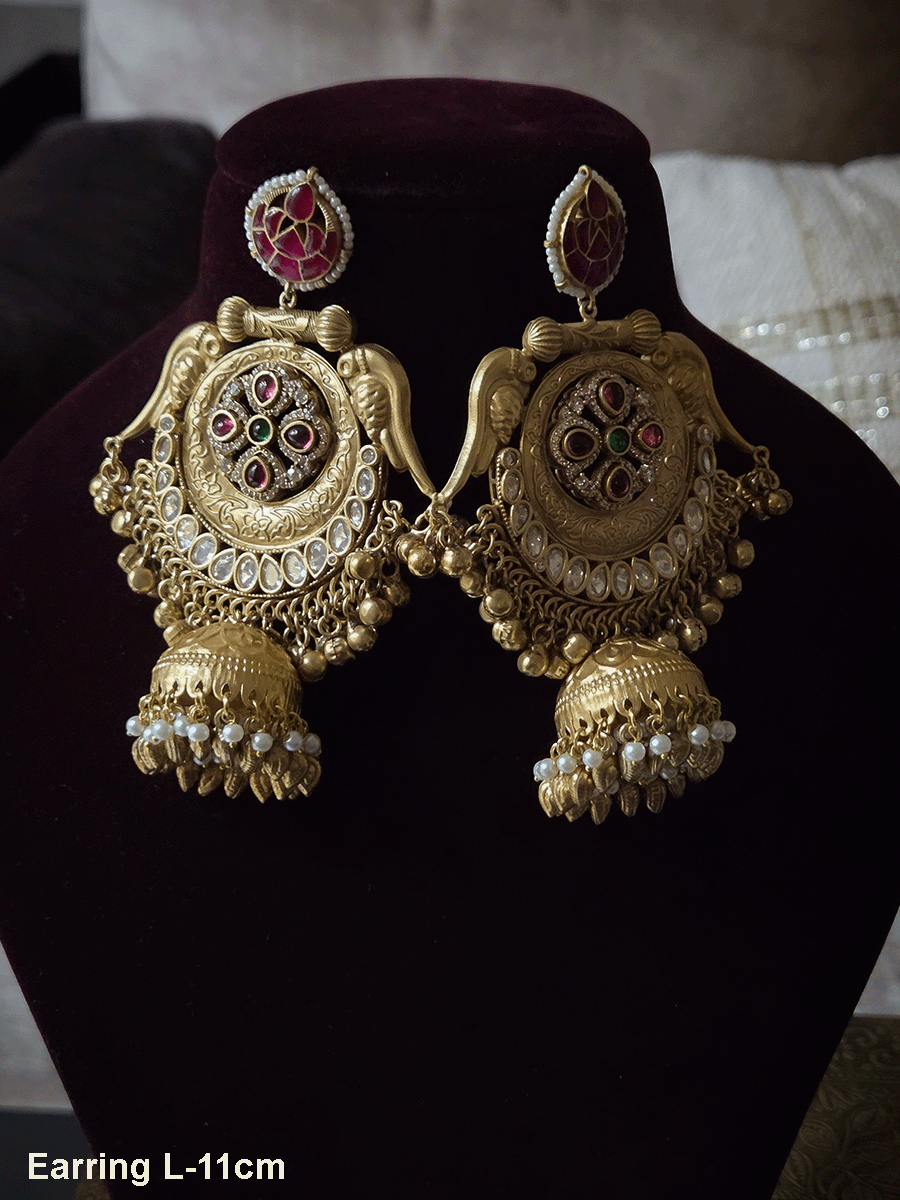 Stone studded leaf top 11cm long jhoomki earrings with peacock side design and polki's