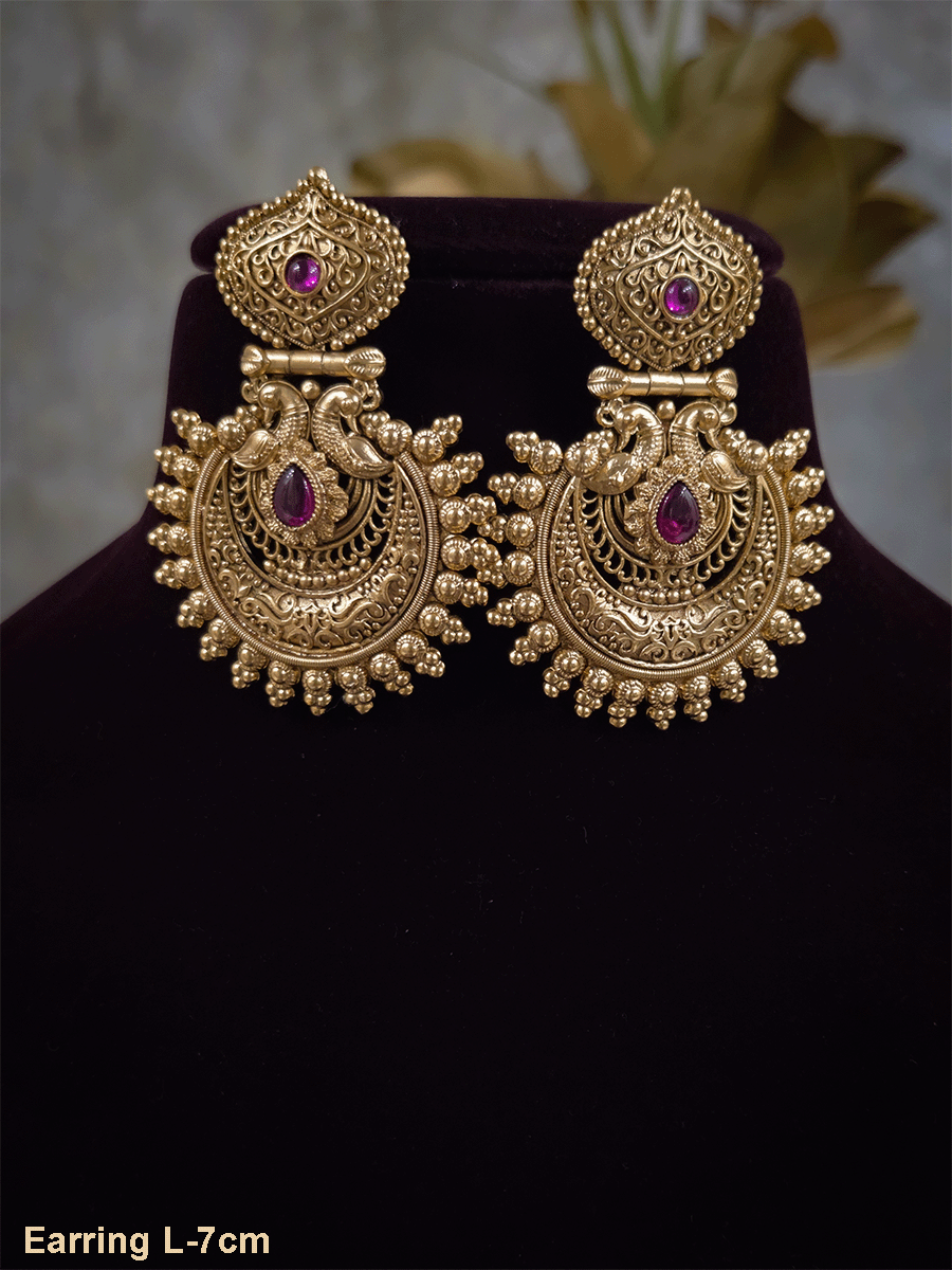 Tear drop ruby stone in intricate peacock design earring