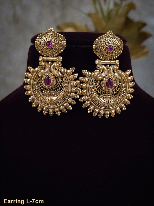 Tear drop ruby stone in intricate peacock design earring