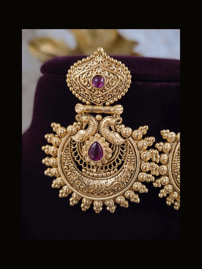 Tear drop ruby stone in intricate peacock design earring