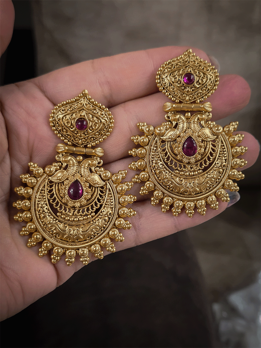 Tear drop ruby stone in intricate peacock design earring