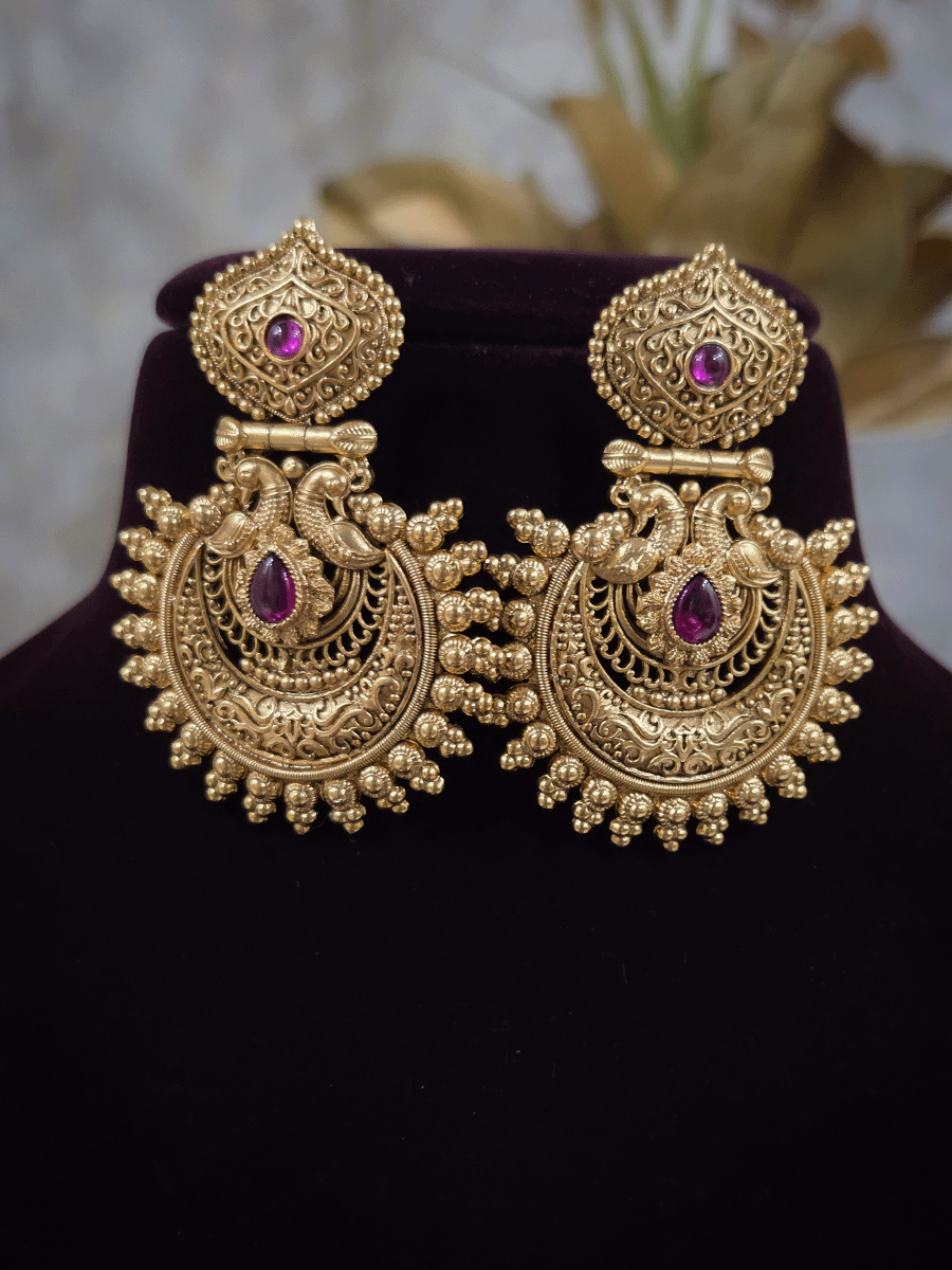 Tear drop ruby stone in intricate peacock design earring