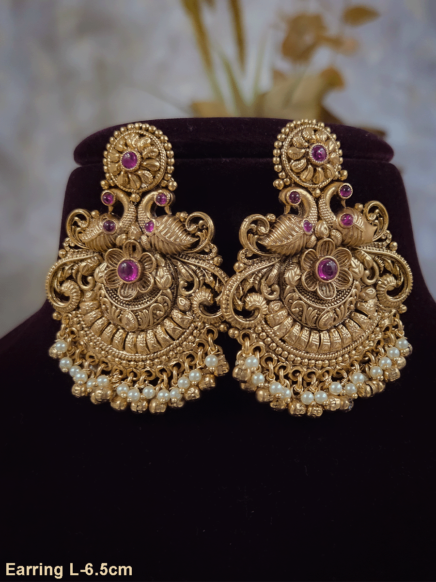 Circular ruby stone top with peacock and flower design earrings with pearly hangings