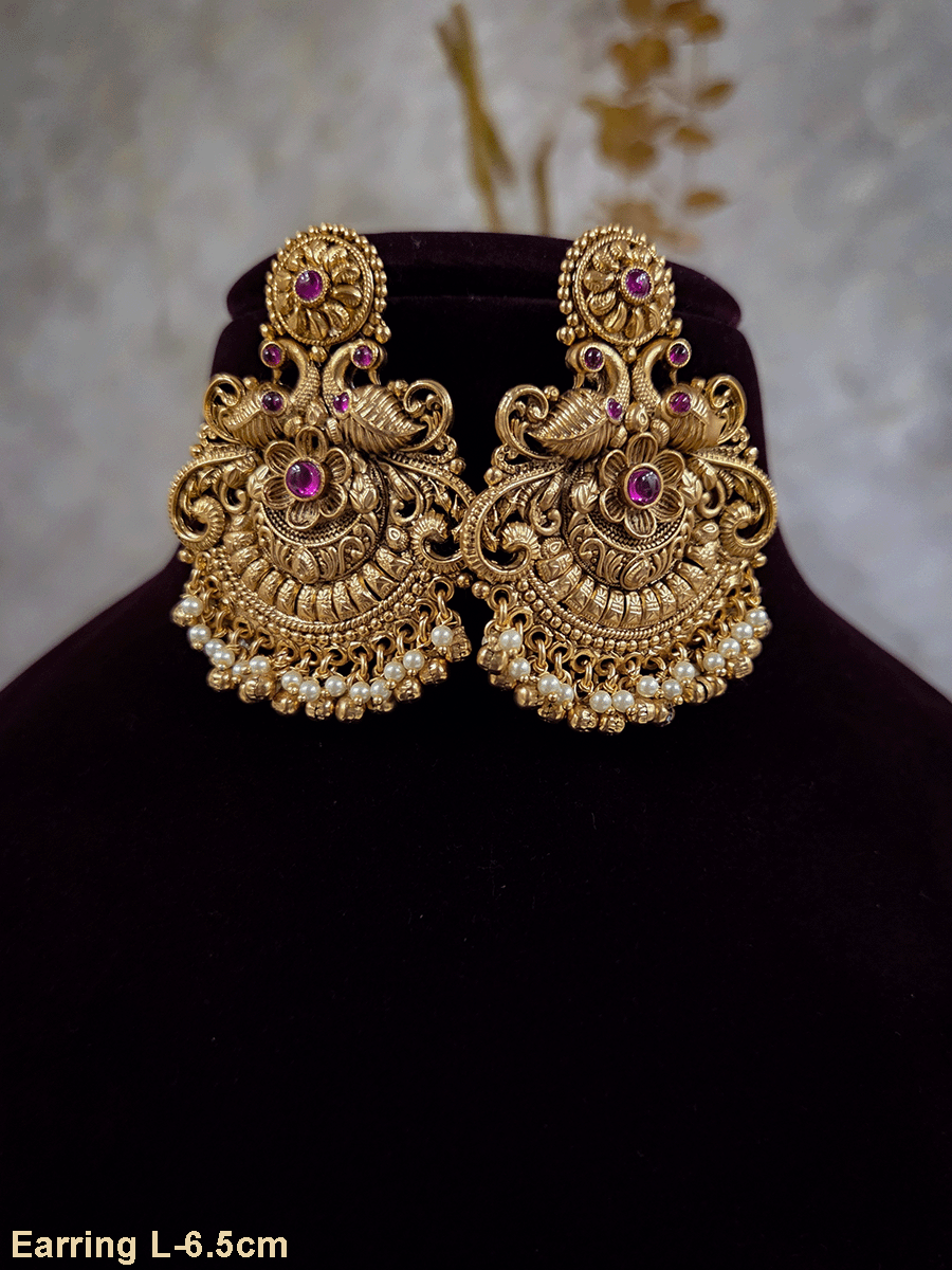 Circular ruby stone top with peacock and flower design earrings with pearly hangings