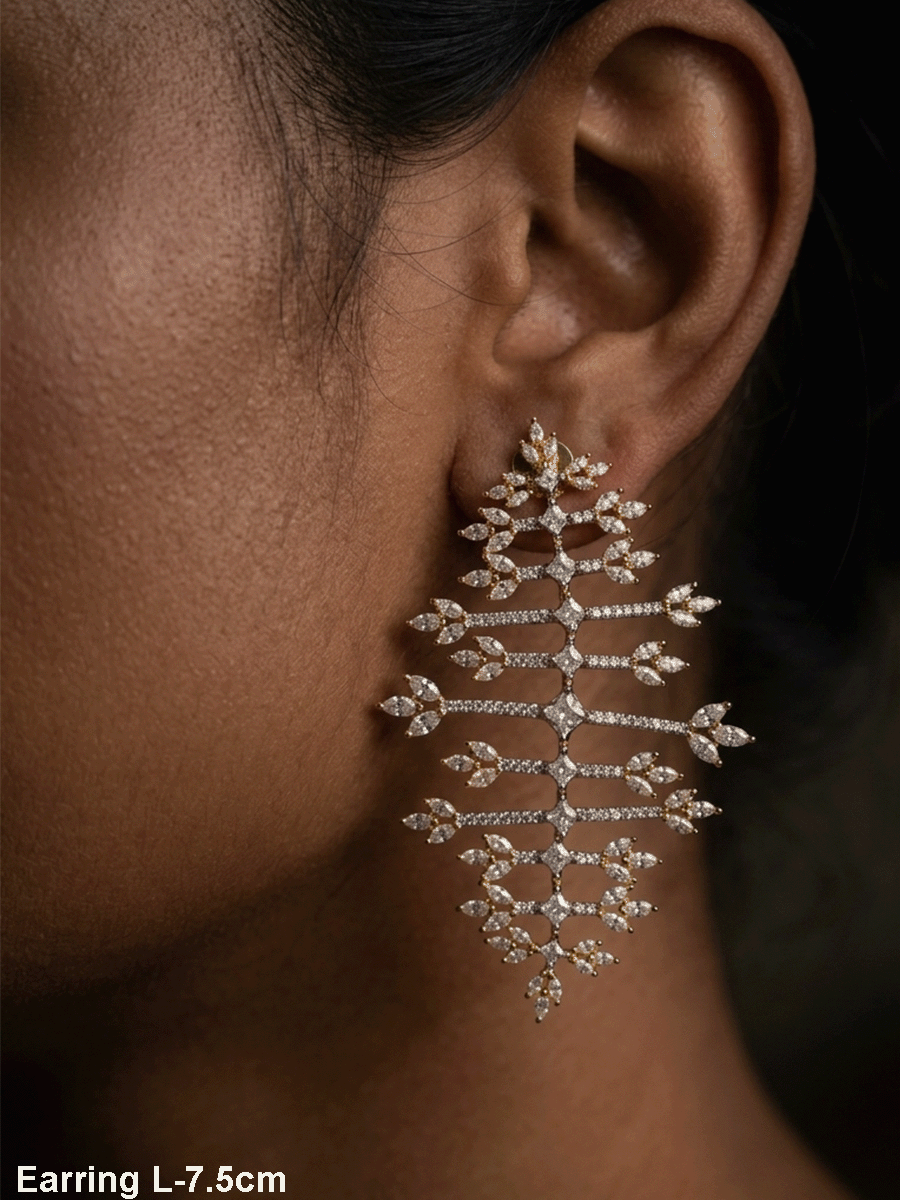 Straight horizontal zircon studded lines with three leaf design at the ends long gold finish flexible earrings