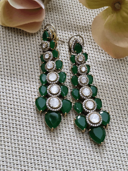 Stones and kundan studded earrings in antique gold finish